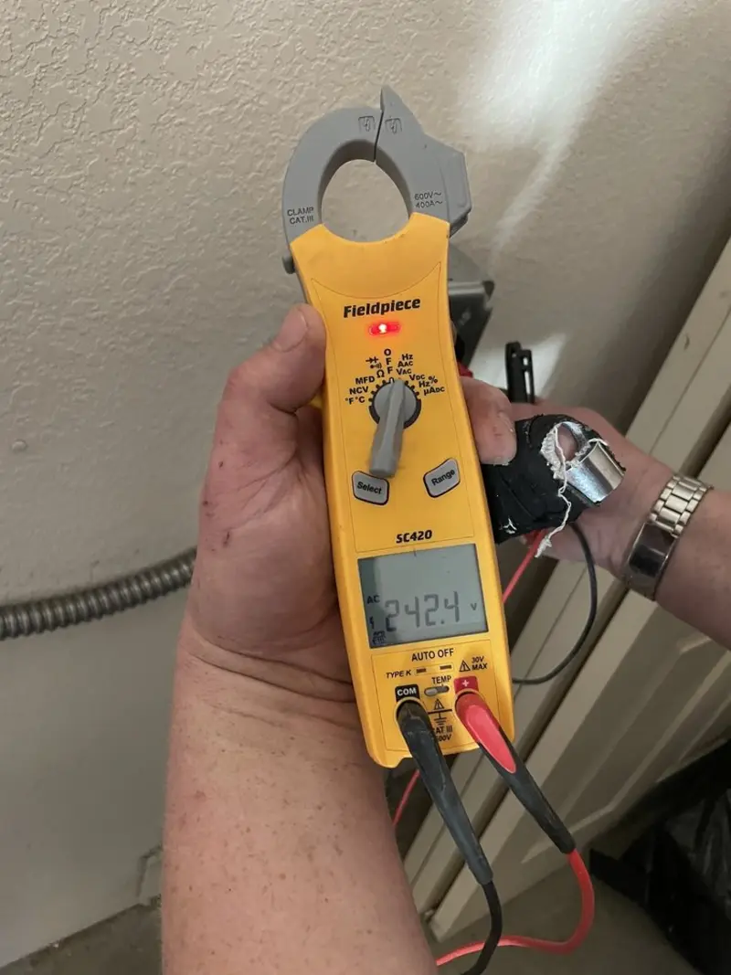 Voltage testing with clamp meter during Recessed Lighting Installation in Fruita